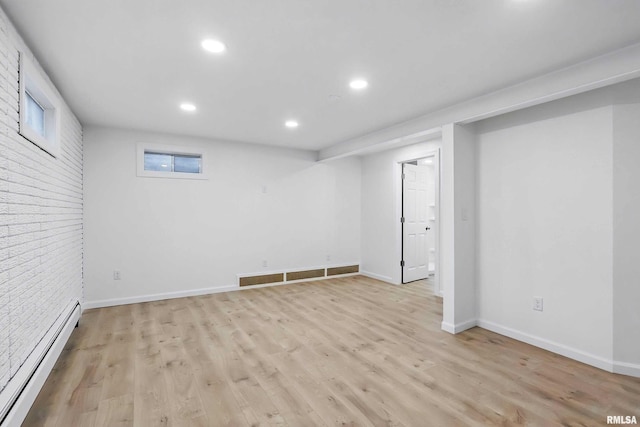 2402 Middle Rd, Davenport, IA 52803 - finished below grade area with baseboard heating, recessed lighting, light wood-type flooring, and baseboards