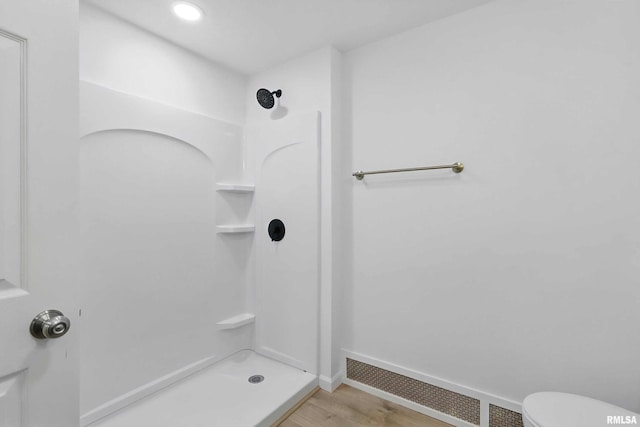 2402 Middle Rd, Davenport, IA 52803 - full bath featuring a shower stall, toilet, wood finished floors, and baseboards