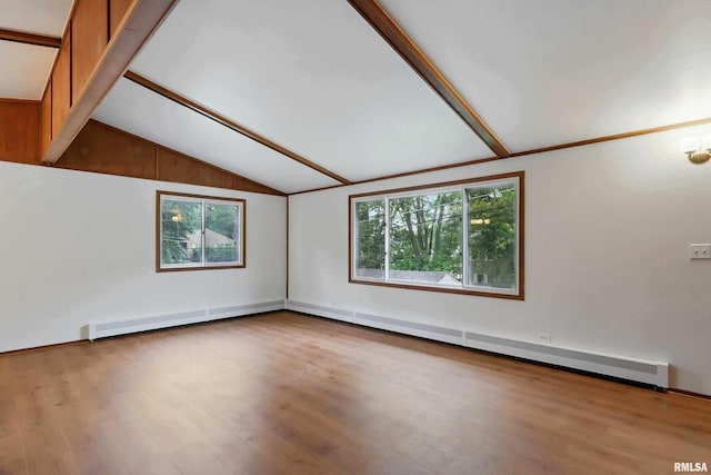 2402 Middle Rd, Davenport, IA 52803 - empty room featuring plenty of natural light, wood finished floors, and a baseboard heating unit