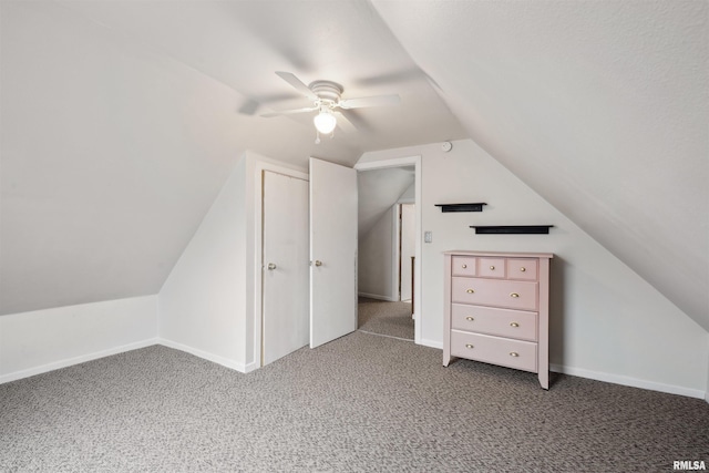716 10th St, De Witt, IA 52742 - additional living space with carpet floors, vaulted ceiling, a ceiling fan, and baseboards