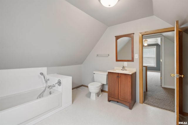 716 10th St, De Witt, IA 52742 - full bathroom featuring a garden tub, vanity, lofted ceiling, toilet, and baseboards