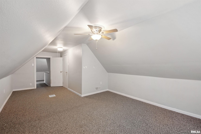 716 10th St, De Witt, IA 52742 - bonus room with baseboards, a ceiling fan, carpet floors, and lofted ceiling