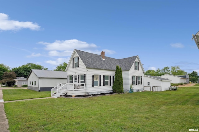 716 10th St, De Witt, IA 52742 - rear view of property featuring a lawn, a chimney, a deck, and roof with shingles