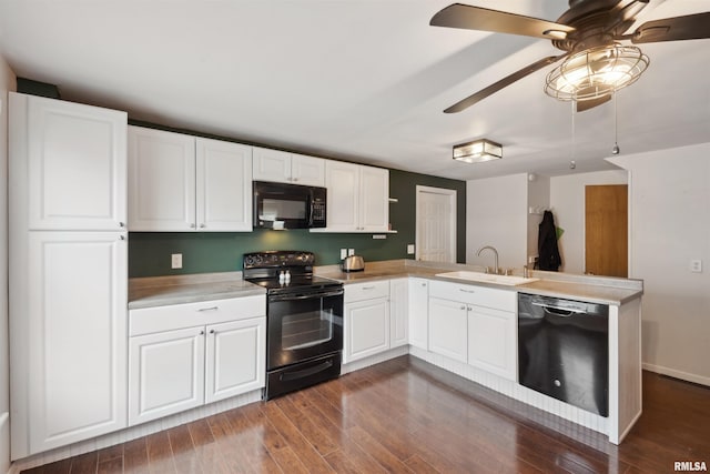 716 10th St, De Witt, IA 52742 - kitchen with black appliances, a sink, a ceiling fan, light countertops, and a peninsula