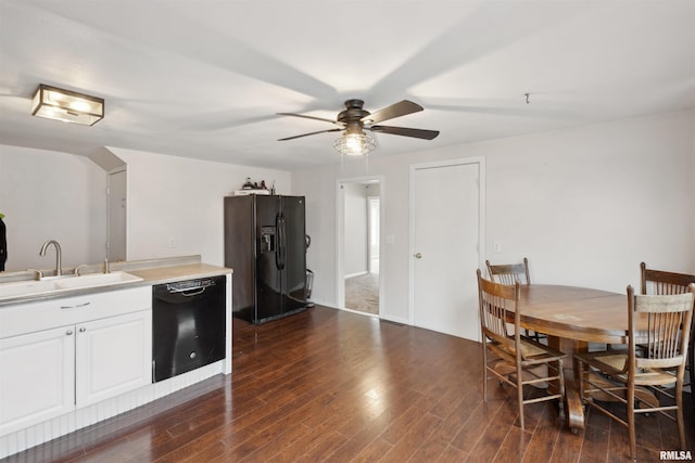 716 10th St, De Witt, IA 52742 - dining room with ceiling fan and dark wood-type flooring