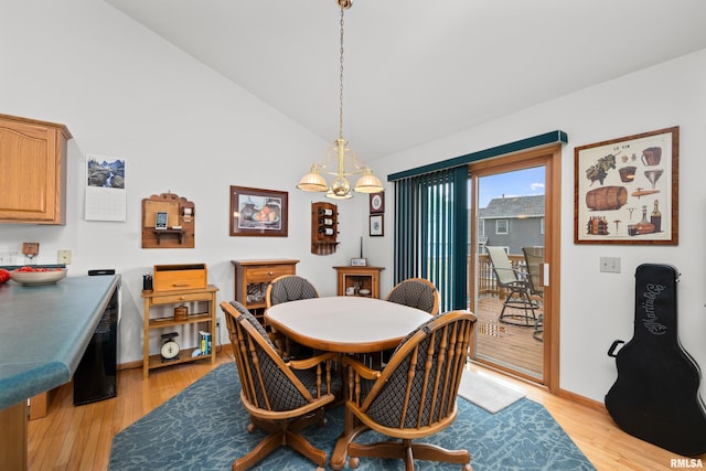 5142 Fillmore Ct, Davenport, IA 52806 - dining area featuring light wood-style flooring, vaulted ceiling, and baseboards