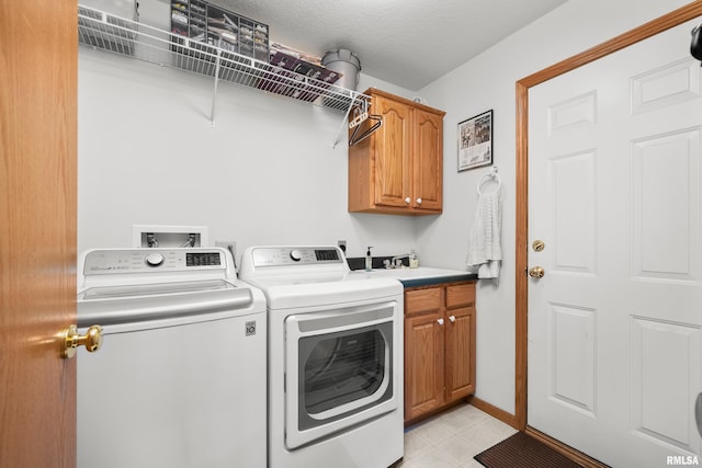 5142 Fillmore Ct, Davenport, IA 52806 - laundry area with separate washer and dryer and cabinet space