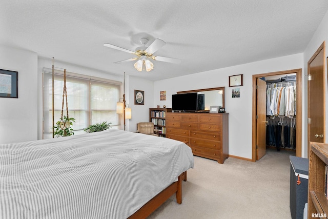 5142 Fillmore Ct, Davenport, IA 52806 - bedroom with a closet, light colored carpet, a spacious closet, a ceiling fan, and baseboards