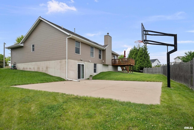 5142 Fillmore Ct, Davenport, IA 52806 - back of house featuring a chimney, brick siding, a patio, and a wooden deck