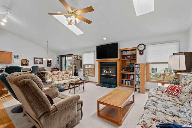 5142 Fillmore Ct, Davenport, IA 52806 - living area with a skylight, lofted ceiling, a tile fireplace, plenty of natural light, and recessed lighting
