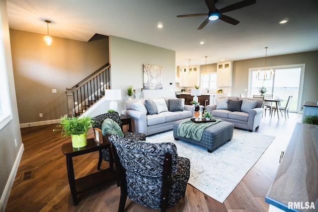 6654 Meghan Ave, Bettendorf, IA 52722 - living area with ceiling fan, stairway, wood finished floors, recessed lighting, and baseboards