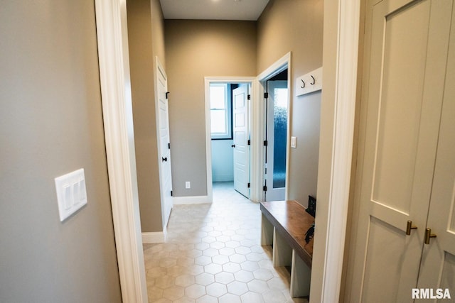 6654 Meghan Ave, Bettendorf, IA 52722 - hall with baseboards and light tile patterned floors