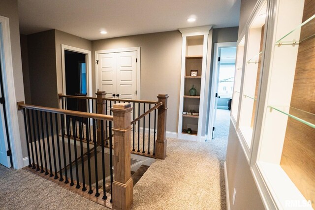 6654 Meghan Ave, Bettendorf, IA 52722 - hallway with an upstairs landing, carpet floors, recessed lighting, and baseboards