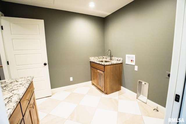 6654 Meghan Ave, Bettendorf, IA 52722 - laundry room featuring washer hookup, cabinet space, light flooring, recessed lighting, and baseboards