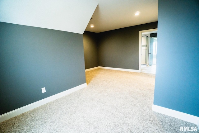 6654 Meghan Ave, Bettendorf, IA 52722 - empty room featuring carpet floors, baseboards, and recessed lighting