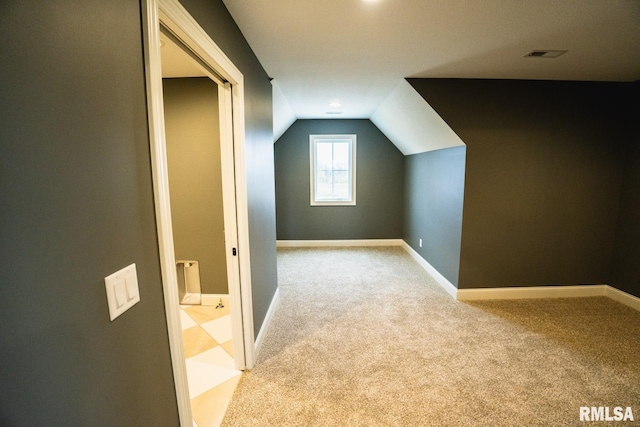 6654 Meghan Ave, Bettendorf, IA 52722 - bonus room with carpet, vaulted ceiling, and baseboards