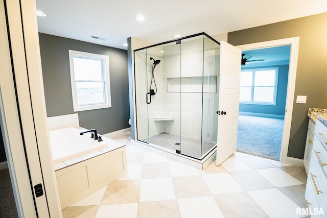 6654 Meghan Ave, Bettendorf, IA 52722 - full bath featuring a shower stall, vanity, a garden tub, toilet, and recessed lighting