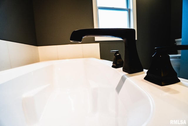 6654 Meghan Ave, Bettendorf, IA 52722 - bathroom view of a sink and a tub to relax in