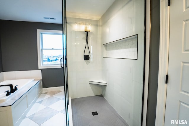 6654 Meghan Ave, Bettendorf, IA 52722 - bathroom with a stall shower, a bath, and tile patterned flooring