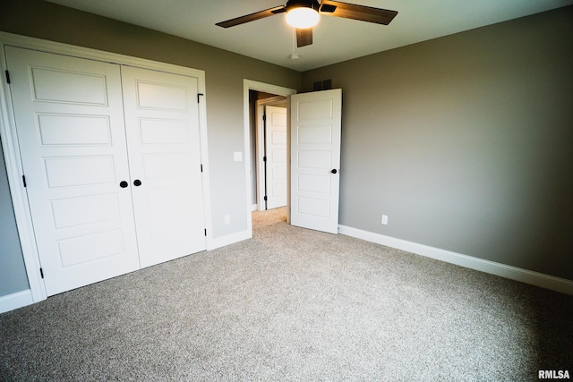 6654 Meghan Ave, Bettendorf, IA 52722 - unfurnished bedroom with carpet floors, a closet, baseboards, and ceiling fan