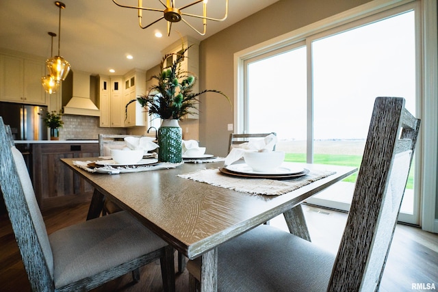 6654 Meghan Ave, Bettendorf, IA 52722 - dining area with healthy amount of natural light, dark wood-style floors, a chandelier, and recessed lighting