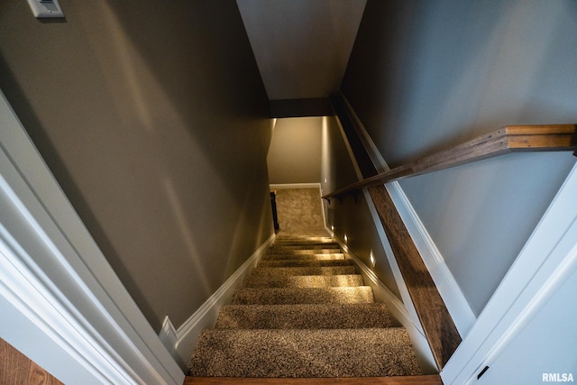 6654 Meghan Ave, Bettendorf, IA 52722 - staircase featuring baseboards and carpet