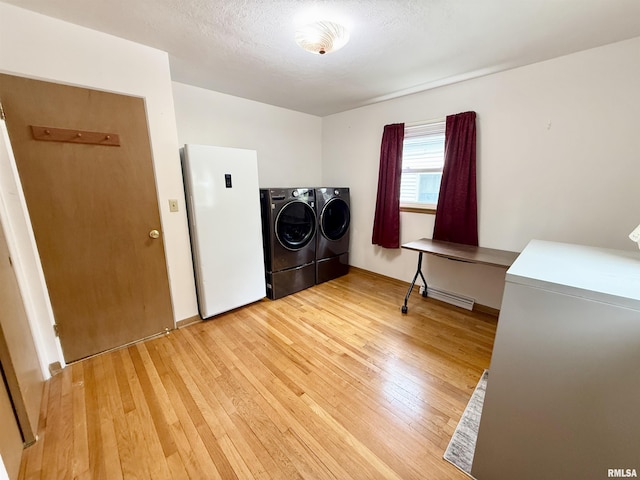 10 Blackhawk Hills Ct, Rock Island, IL 61201 - laundry room featuring washing machine and dryer, light wood finished floors, and baseboards