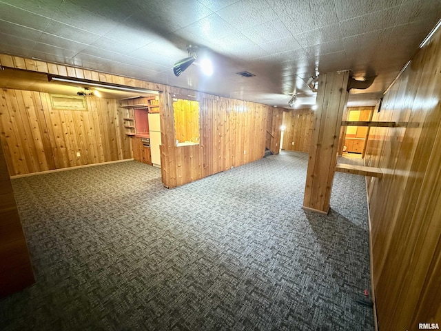 10 Blackhawk Hills Ct, Rock Island, IL 61201 - finished below grade area featuring carpet, wooden walls, and baseboards