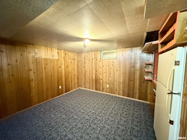 10 Blackhawk Hills Ct, Rock Island, IL 61201 - finished basement featuring freestanding refrigerator, wooden walls, and carpet
