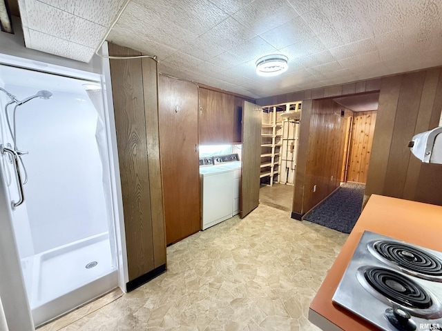 10 Blackhawk Hills Ct, Rock Island, IL 61201 - kitchen with wood walls, washer / dryer, and electric cooktop
