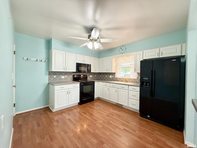 10 Blackhawk Hills Ct, Rock Island, IL 61201 - kitchen with black appliances, decorative backsplash, white cabinetry, and ceiling fan