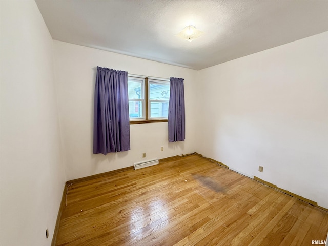 10 Blackhawk Hills Ct, Rock Island, IL 61201 - unfurnished room featuring light wood-type flooring and baseboard heating