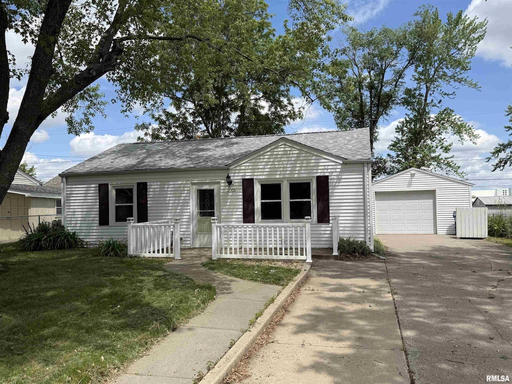 2006 W 75th Pl, Davenport, IA 52806 - view of front of property with an outdoor structure, driveway, a detached garage, a porch, and a shingled roof