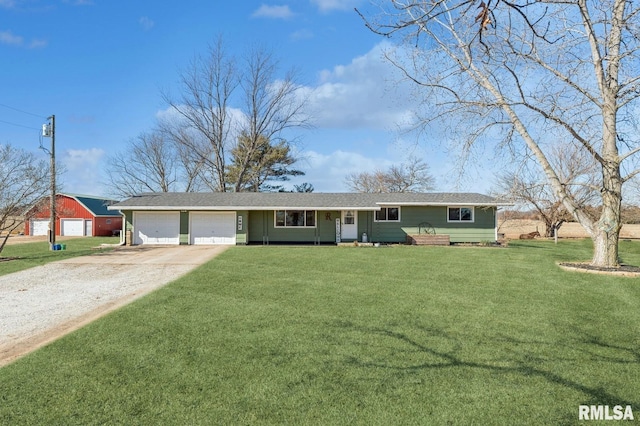944 45th St, New Boston, IL 61272 - ranch-style house with driveway, an attached garage, a front yard, and a shingled roof