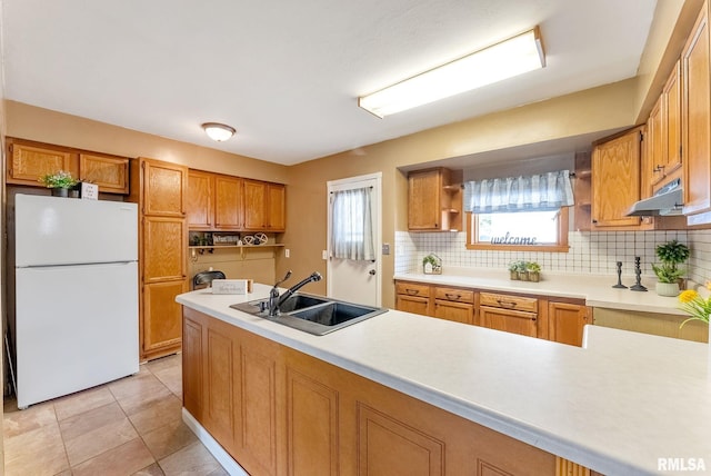 2215 N Nevada Ave, Davenport, IA 52804 - kitchen with freestanding refrigerator, open shelves, decorative backsplash, and light countertops