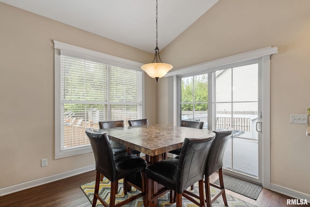 3484 Field Sike Dr, Bettendorf, IA 52722 - dining space with baseboards, dark wood finished floors, and lofted ceiling