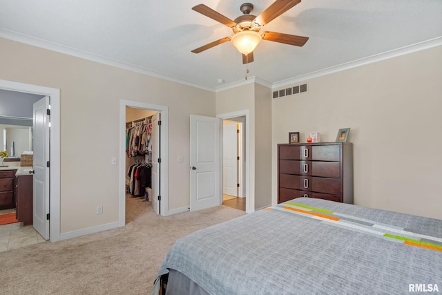 3484 Field Sike Dr, Bettendorf, IA 52722 - bedroom featuring light carpet, crown molding, a spacious closet, baseboards, and a closet
