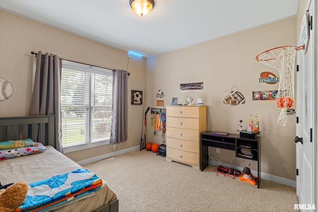 3484 Field Sike Dr, Bettendorf, IA 52722 - carpeted bedroom featuring multiple windows and baseboards