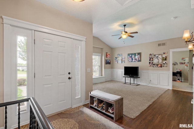 3484 Field Sike Dr, Bettendorf, IA 52722 - entryway with wood finished floors, ceiling fan, vaulted ceiling, a wainscoted wall, and a decorative wall