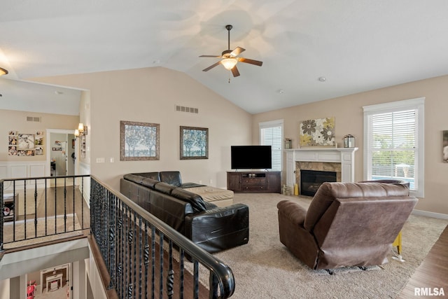3484 Field Sike Dr, Bettendorf, IA 52722 - living room with a ceiling fan, a tile fireplace, plenty of natural light, wood finished floors, and high vaulted ceiling