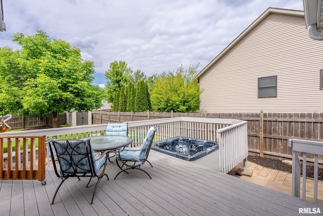 3484 Field Sike Dr, Bettendorf, IA 52722 - wooden deck with outdoor dining space and a fenced backyard