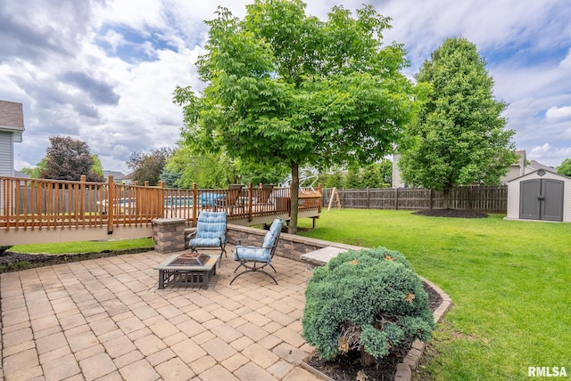 3484 Field Sike Dr, Bettendorf, IA 52722 - view of patio / terrace with an outdoor fire pit and a wooden deck