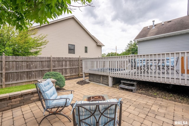 3484 Field Sike Dr, Bettendorf, IA 52722 - view of patio featuring a wooden deck and an outdoor fire pit