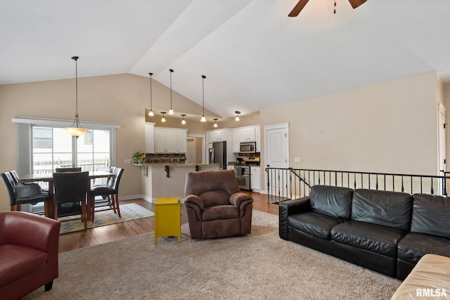 3484 Field Sike Dr, Bettendorf, IA 52722 - living area with ceiling fan, wood finished floors, and high vaulted ceiling