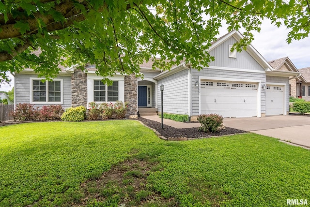 3484 Field Sike Dr, Bettendorf, IA 52722 - view of front of home with a garage, driveway, and stone siding