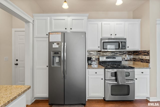 3484 Field Sike Dr, Bettendorf, IA 52722 - kitchen with appliances with stainless steel finishes, white cabinetry, decorative backsplash, light stone countertops, and dark wood-type flooring