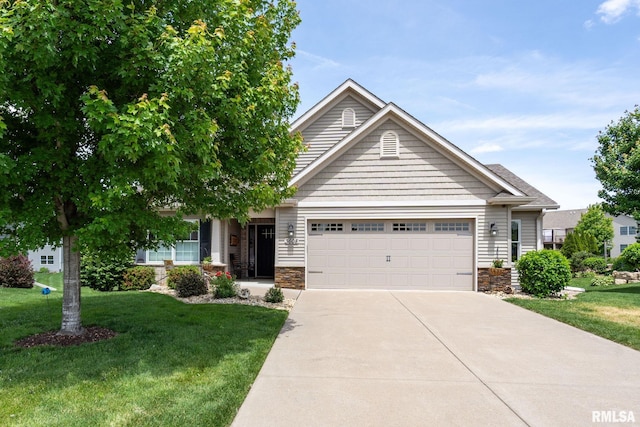3608 Glengevlin Way, Bettendorf, IA 52722 - view of front of property with an attached garage, stone siding, concrete driveway, and a front lawn
