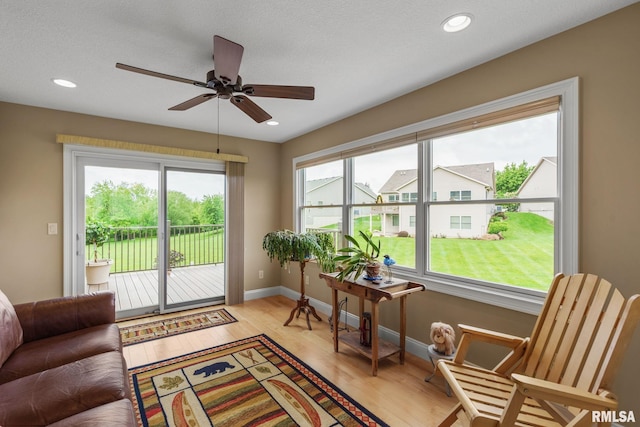 3608 Glengevlin Way, Bettendorf, IA 52722 - living room with ceiling fan, baseboards, light wood-type flooring, and recessed lighting