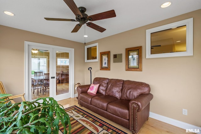 3608 Glengevlin Way, Bettendorf, IA 52722 - living room with french doors, a ceiling fan, baseboards, recessed lighting, and light wood-style flooring
