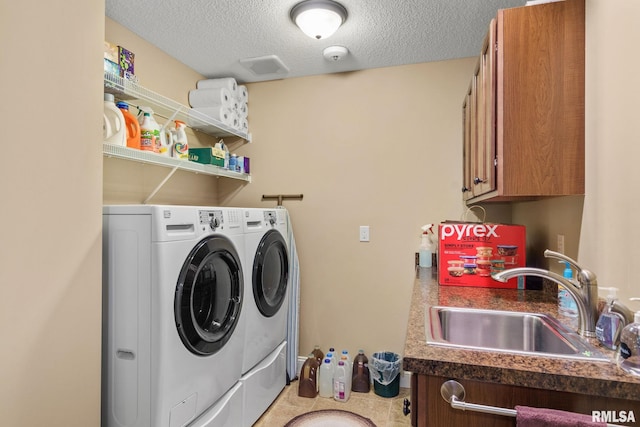 3608 Glengevlin Way, Bettendorf, IA 52722 - laundry room with washer and clothes dryer, a textured ceiling, and cabinet space
